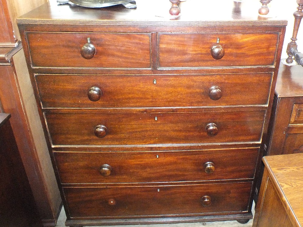 A Victorian mahogany chest of two short drawers over four graduated drawers on bun feet