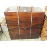 A large square mahogany metal bound storage chest