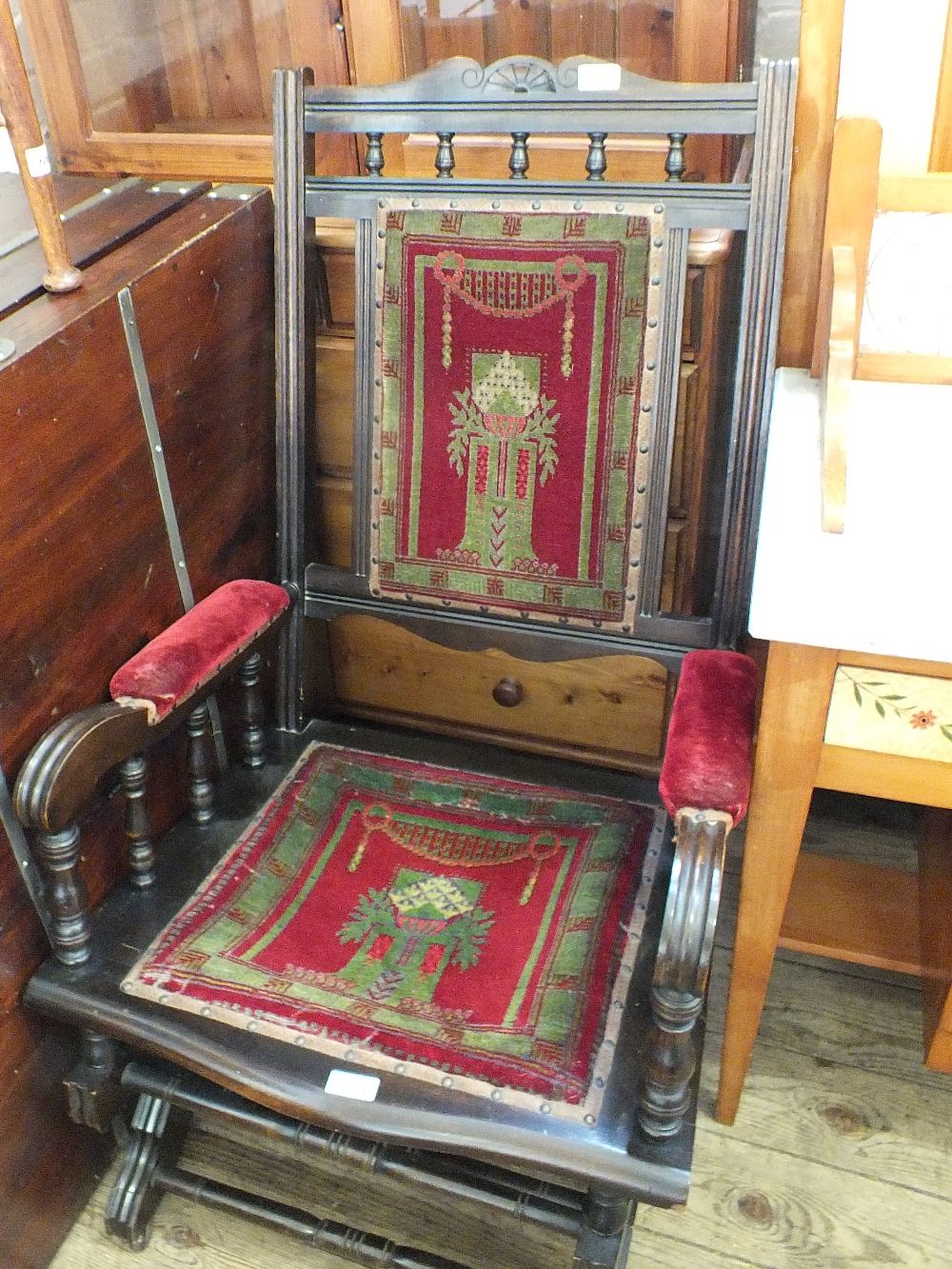 An American style upholstered rocking chair