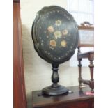 A Victorian papier mache folding tilt top table with mother of pearl inlaid and painted floral