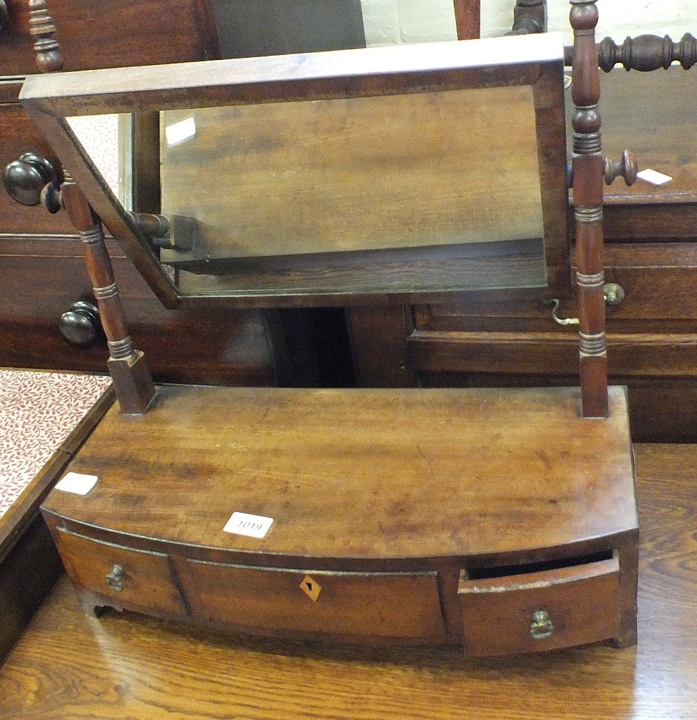 A mahogany swing toilet mirror with three drawers to base