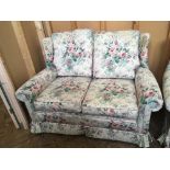 Two Marks and Spencer floral upholstered two seater sofa and armchair with matching foot stool