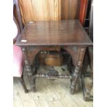 A Victorian oak Gothic style side table