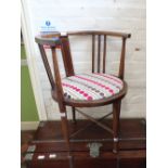 A mahogany half moon inlaid bedroom chair with modern upholstery