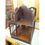 A mahogany two tier miniature revolving bookcase