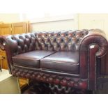 A modern two seater Chesterfield and matching armchair