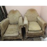 A pair of Victorian gold upholstered and limed oak framed armchairs on claw feet