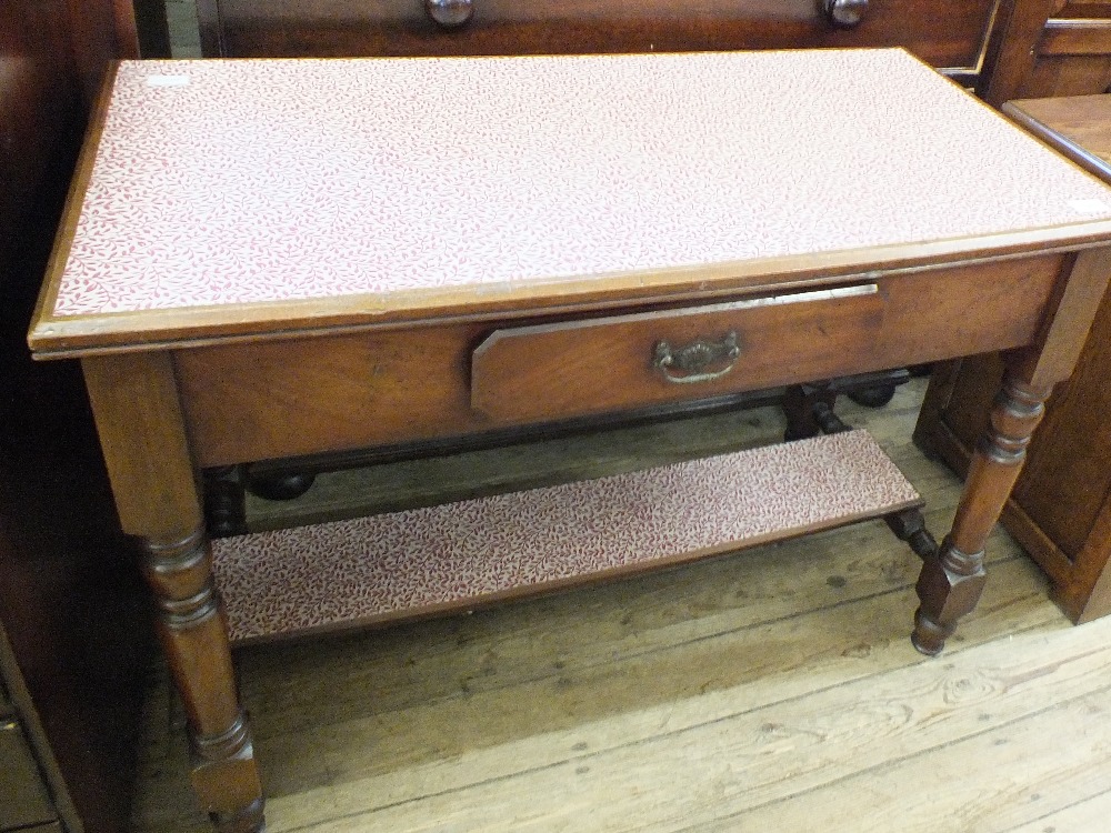 A mahogany single drawer hall table on turned legs and stretcher base