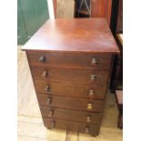 A stained pine and mahogany veneered narrow chest of six drawers