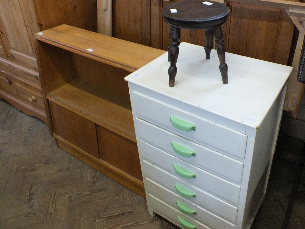 A white painted chest of six drawers, a small stool, a modern Maple Quality bookcase,