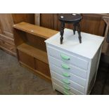 A white painted chest of six drawers, a small stool, a modern Maple Quality bookcase,