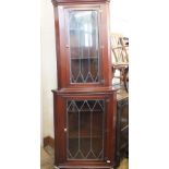 A mahogany lead glazed corner cupboard