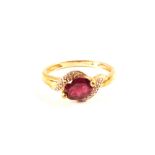 A 9ct gold diamond and pink stone ring,