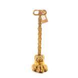 A 19th Century lions paw brass doorstop with leafage stem and open handle, iron weighted,