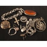 A quantity of silver and white metal jewellery including charm bracelet,