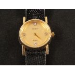 A 14ct gold Geneve Quartz lady's wristwatch with white set stone dial