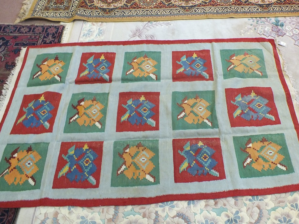 A decorative flat weave rug,