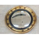 An inlaid mahogany oval mirror,