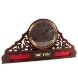 A commercial mahogany clock of wide proportions in fretted case with rear mounted hand adjustment