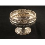 A silver foliate decorated bowl with pierced gallery,