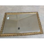 Oval and gilt wall mirrors,
