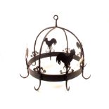A wrought iron chicken hanging rack