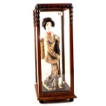 A Japanese cloth female musician in glazed case