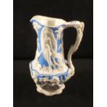 A Victorian salt glazed relief moulded lady and children jug