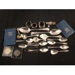 Silver and silver plated cutlery to include a pair of Georgian dessert spoons and a few coins