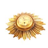 A giltwood sunburst wall clock