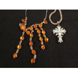 A silver amber set necklace and a silver opal and white stone set cross necklace on silver chain