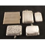 Four various silver vestas plus a plated card case