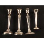 A pair of silver candlesticks,