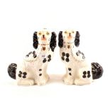 A pair of late Victorian Staffordshire dogs