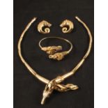 A suite of gold jewellery of horse design consisting of a link necklace with cross over horse head