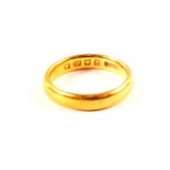 A 22ct gold wedding band,