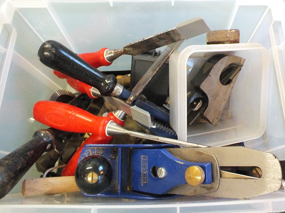 A box of various woodworking tools