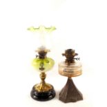 A Victorian brass column oil lamp with painted green glass bowl and etched shade plus one other