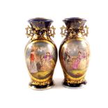 A pair of 19th Century porcelain blue ground and gilt figure decorated vases,