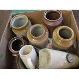 Various stoneware jars and a foot warmer