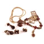 A large silver red stone and marcasite set necklace in floral design with similar earrings and