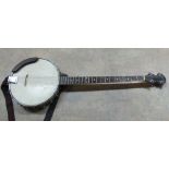 A cased Woodring four string banjo,