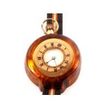 A 9ct gold fob watch with later faux tortoiseshell holder for wristwatch conversion on strap (case