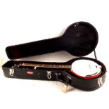 A cased Ridgewood five string banjo