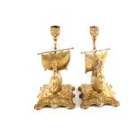 A pair of Victorian brass Viking ship candlesticks