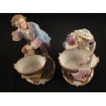 A pair of 19th Century German porcelain figures of a washerman and woman,