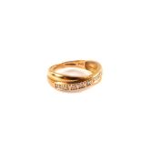 A 9ct gold diamond crossover ring,