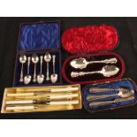 A set of six silver coffee spoons, knife,