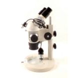 A 'Pzo' bifocal dissecting microscope with six variable magnifications on an adjustable stem