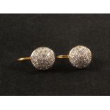 A pair of 18ct gold diamond set 'bombe' style earrings